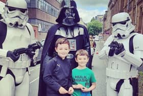 Two young visitors at the Healthier Heroes' Armed Forces Day meet the Star Wars characters