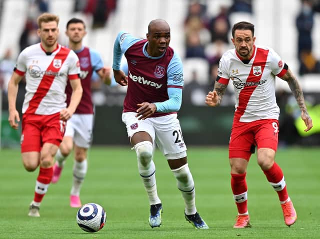 Angelo Ogbonna of West Ham United battles for possession with Danny Ings of Southampton during the Premier League match between West Ham United and Southampton at London Stadium on May 23, 2021 in London, England.