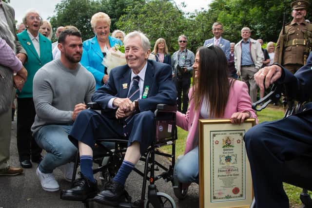 Bob at the Freedom of the Town presentation surrounded by family, including his wife Ann, granddaughter Sophie and Sophie's partner Jason (photo by Naz Alam)