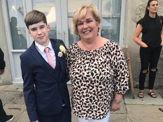 Sue Plunkett with her son Robbie at his dad's wedding