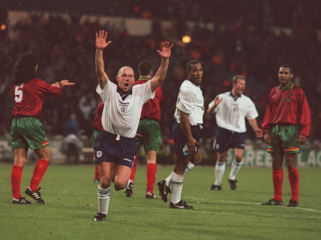 Steve Stone of England celebrates after scoring the opening goal during the England v Portugal International friendly match at Wembley Stadium, London, in December 1995.