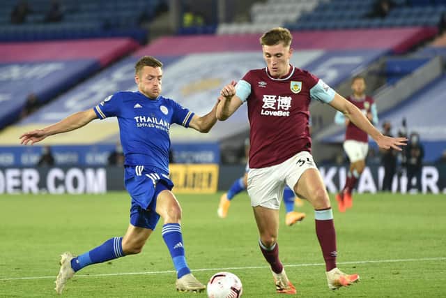 Jamie Vardy of Leicester City battles for possession with Jimmy Dunne of Burnley during the Premier League match between Leicester City and Burnley at The King Power Stadium on September 20, 2020 in Leicester, England.
