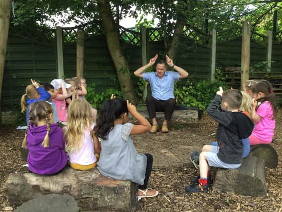 Nick Hennessey entertains children at Ribblesdale Nursery School in Clitheroe