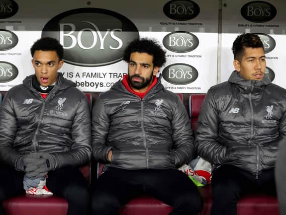 Trent Alexander-Arnold, Mo Salah and Roberto Firmino of Liverpool on the Burnley away bench