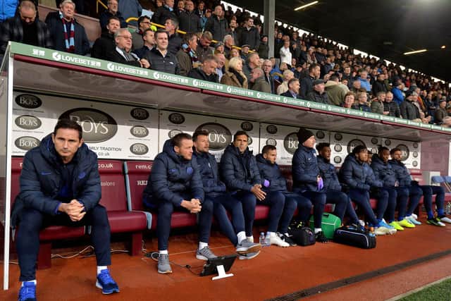 Frank Lampard and the Chelsea team enjoy the comforts of the Turf Moor dug out in 2019