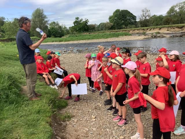 RRT education officer Neil Ashworth and children from Chatburn Primary School