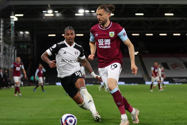 Jay Rodriguez of Burnley is closed down by Mario Lemina of Fulham during the Premier League match between Fulham and Burnley at Craven Cottage on May 10, 2021 in London, England.
