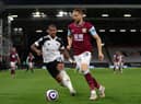 Jay Rodriguez of Burnley is closed down by Mario Lemina of Fulham during the Premier League match between Fulham and Burnley at Craven Cottage on May 10, 2021 in London, England.