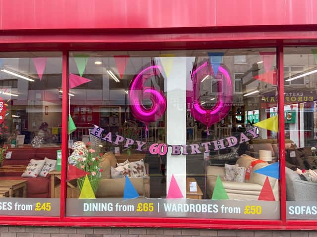 The BHF store in Preston celebrates the charity's 60th birthday with an eye catching window display