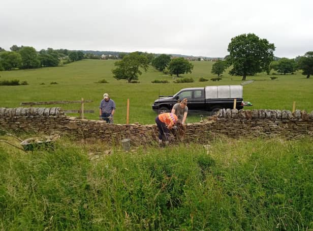 Volunteers working on the Martholme Greenway, a section of a disused railway line that used to run between Burnley and Blackburn