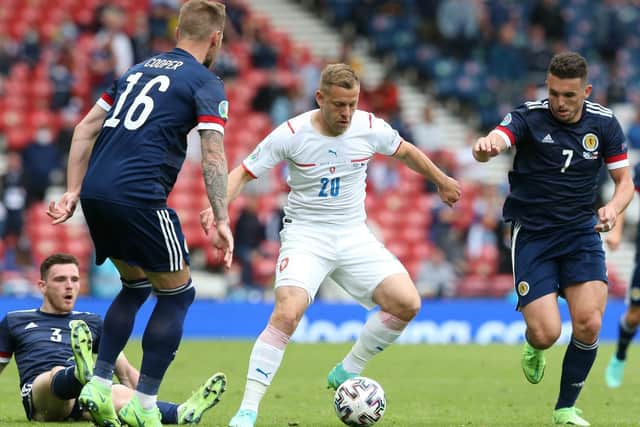 Matej Vydra of Czech Republic is closed down by Andrew Robertson, Liam Cooper and John McGinn of Scotland during the UEFA Euro 2020 Championship Group D match between Scotland v Czech Republic at Hampden Park on June 14, 2021 in Glasgow, Scotland.