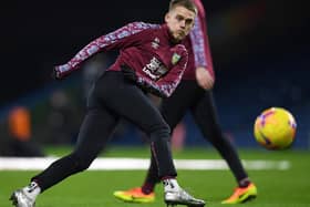 Burnley's English midfielder Josh Benson warms up ahead of the English Premier League football match between Burnley and Manchester City at Turf Moor in Burnley, north west England on February 3, 2021.