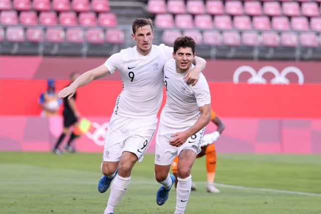 Chris Wood #9 of Team New Zealand celebrates with teammate Liberato Cacace #3 after scoring their side's second goal against Honduras on day two of the Tokyo 2020 Olympic Games at Ibaraki Kashima Stadium on July 25, 2021 in Kashima, Ibaraki, Japan.