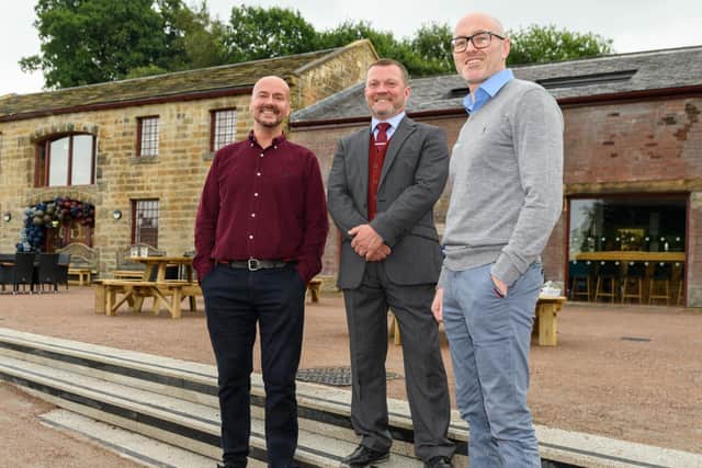 (l-r) Glenn Davidson and Lee Shepherd, directors/owners of Finsley Gate Wharf with David Greenhalgh from the Canal and Rivers Trust. Photo: Kelvin Stuttard