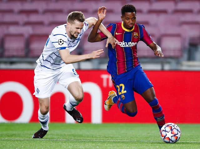Ansu Fati of FC Barcelona dribbles Tomasz Kedziora of FC Dinamo de Kiev during the UEFA Champions League Group G stage match between FC Barcelona and Dynamo Kyiv at Camp Nou on November 04, 2020 in Barcelona, Spain.