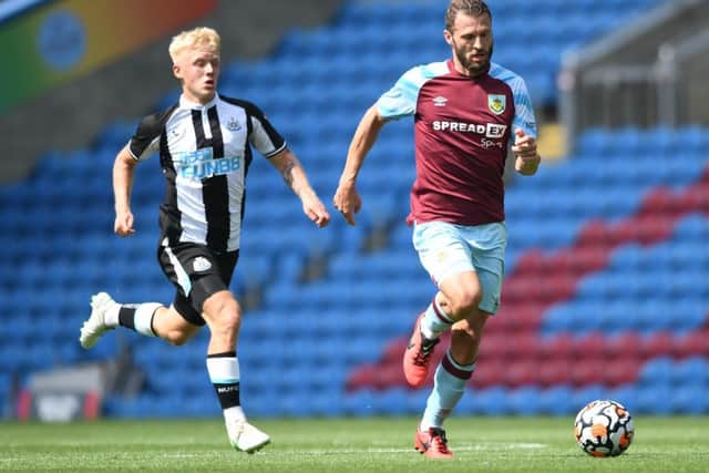 Erik Pieters carries the ball during the pre-season friendly between Burnley and Newcastle united at Turf Moor.