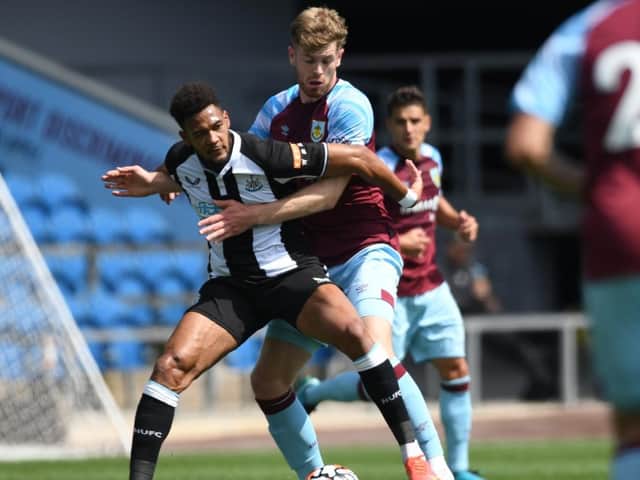 Nathan Collins refuses to give Joelinton room to manoeuvre in the pre-season friendly between Burnley and Newcastle United at Turf Moor