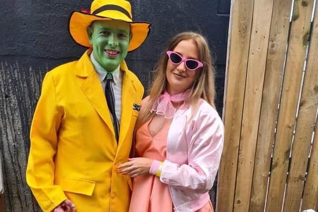 A pink lady from Grease joins forces with Jim Carrey's character from The Mask