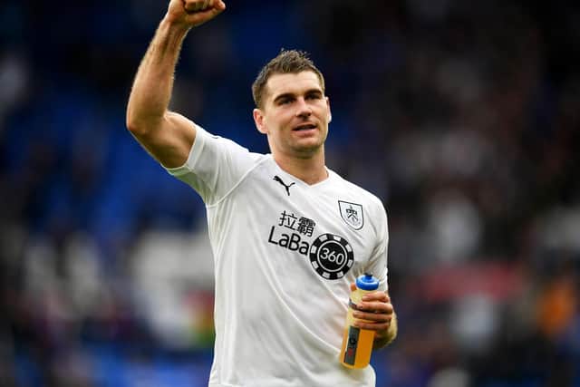 Sam Vokes of Burnley celebrates following his sides victory in the Premier League match between Cardiff City and Burnley FC at Cardiff City Stadium on September 30, 2018 in Cardiff, United Kingdom.