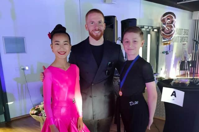 Tomasz with 'Strictly Come Dancing' star Neil Jones and another young dancer