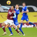 Dwight McNeil of Burnley battles for possession with Joel Veltman of Brighton & Hove Albion during the Premier League match between Burnley and Brighton & Hove Albion at Turf Moor on February 06, 2021 in Burnley, England.