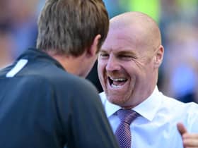 Graham Potter, Manager of Brighton and Hove Albion greets Sean Dyche, Manager of Burnley prior to the Premier League match between Brighton & Hove Albion and Burnley FC at American Express Community Stadium on September 14, 2019 in Brighton, United Kingdom.