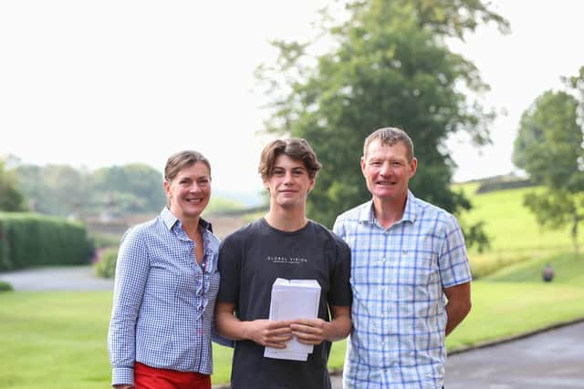 Jack Hutchinson celebrating excellent A-level results with his parents.