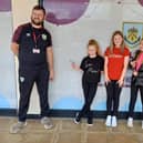 Neve Parkinson, Connie Cardiff and Evie Broadley at the Burnley FC Community Kitchen