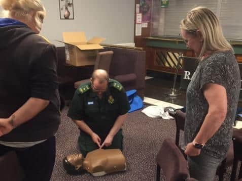 Volunteers learn how to give CPR at the free first aid sessions run by Lancashire Ambulance Service
