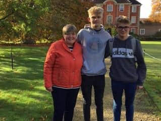 Will, (centre), pictured with his mum Angela and brother Oliver  outside Lady Margaret Hall