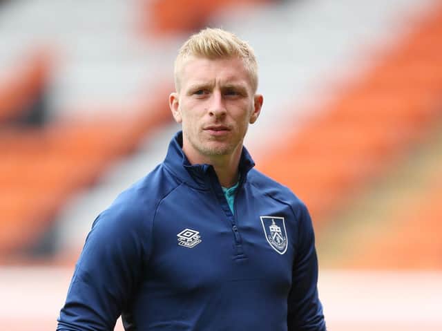 Ben Mee of Burnley looks on as he makes his way towards the dressing room after inspecting the pitch prior to the Pre-Season Friendly match between Blackpool and Burnley at Bloomfield Road on July 27, 2021 in Blackpool, England.