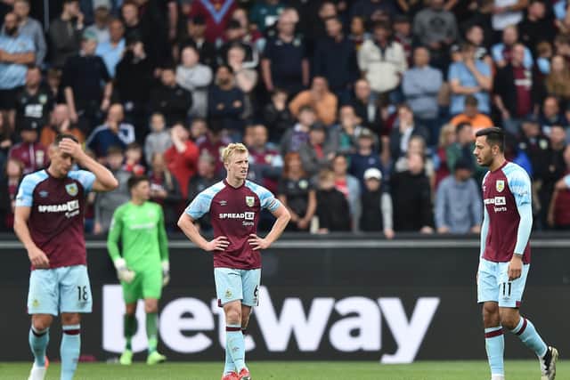 Ben Mee of Burnley looks dejected after the Brighton and Hove Albion second goal scored by Alexis Mac Allister during the Premier League match between Burnley and Brighton & Hove Albion at Turf Moor on August 14, 2021 in Burnley, England.