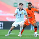 Ryan Christie of Scotland battles for possession with Jurrien Timber of Netherlands during the international friendly match between Netherlands and Scotland at Estadio Algarve on June 02, 2021 in Faro, Portugal.