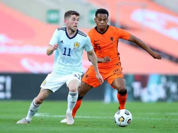 Ryan Christie of Scotland battles for possession with Jurrien Timber of Netherlands during the international friendly match between Netherlands and Scotland at Estadio Algarve on June 02, 2021 in Faro, Portugal.
