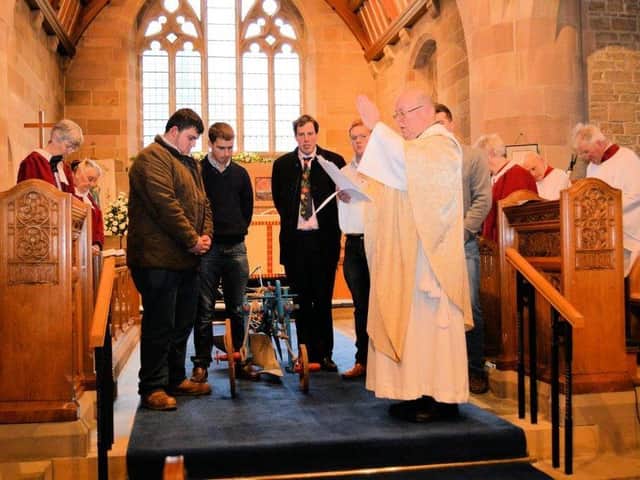 Canon Ron gives a harvest blessing at a service attended by Bilsborrow Young Farmers