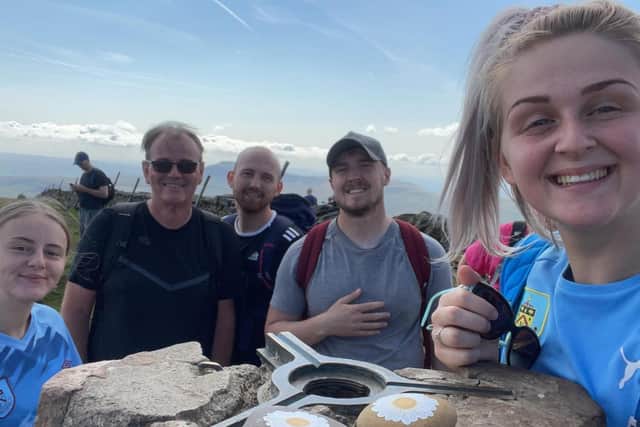 A thumbs up from Jodie and her team who completed the Three Peaks challenge