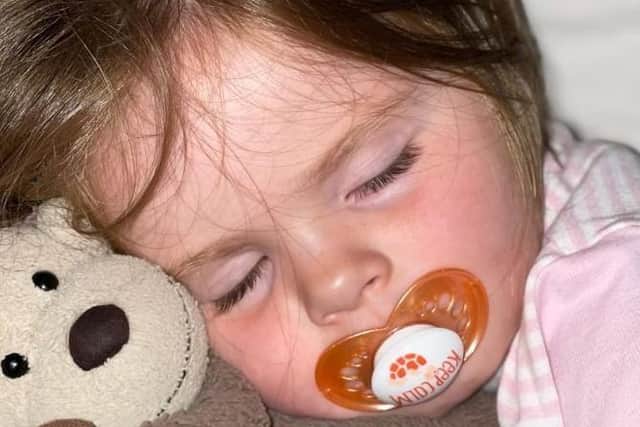 The family of little Olive Bannister are offering a cash reward for the return of her favourite toy, Mo Mo the monkey after it was lost in a Pendle park