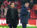 Sky Sports Pundits Gary Neville and Jamie Carragher are seen on the pitch prior to the Premier League match between Liverpool FC and Manchester United at Anfield on January 19, 2020 in Liverpool, United Kingdom.