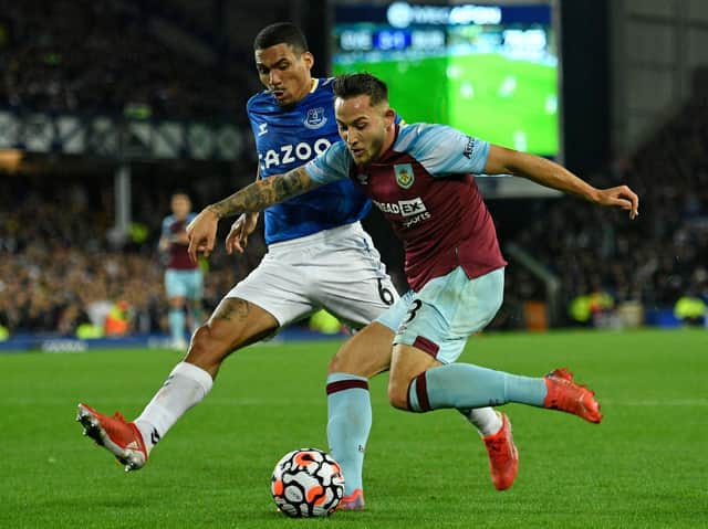 Everton's Brazilian midfielder Allan (L) vies with Burnley's English midfielder Josh Brownhill (R) during the English Premier League football match between Everton and Burnley at Goodison Park in Liverpool, north west England on September 13, 2021.