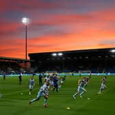 Players of Burnley warm up ahead of the Carabao Cup Third Round match between Burnley and Rochdale at Turf Moor on September 21, 2021 in Burnley, England.