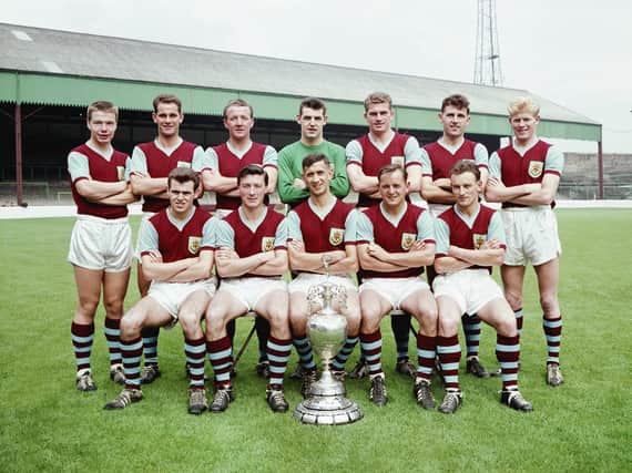 The Burnley Division One championship winning squad of season 1959-60 pose with the trophy at Turf Moor, Burnley, England, selected players include Ray Pointer (back row right)John Connelly (front row left) Jimmy McIlroy (front row second left) Jimmy Adamson (front row centre).