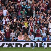 Burnley player Maxwel Cornet and the Burnley fans react after a chance is missed during the Premier League match between Burnley and Arsenal at Turf Moor on September 18, 2021 in Burnley, England.