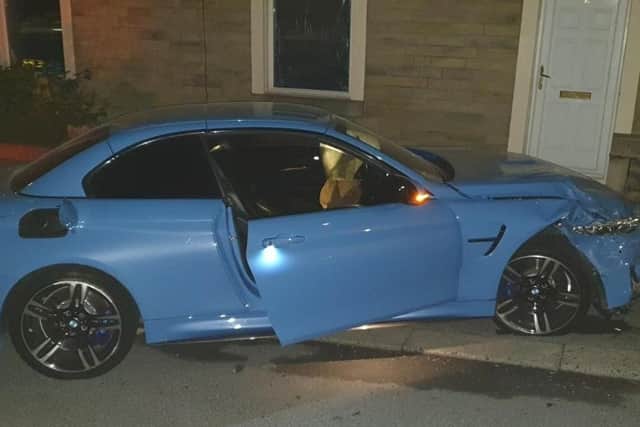 The BMW M4 crashed into a lamp post and a parked car in the Burnley Wood area