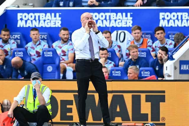Sean Dyche, Manager of Burnley gives instructions to his players during the Premier League match between Leicester City and Burnley at The King Power Stadium on September 25, 2021 in Leicester, England.