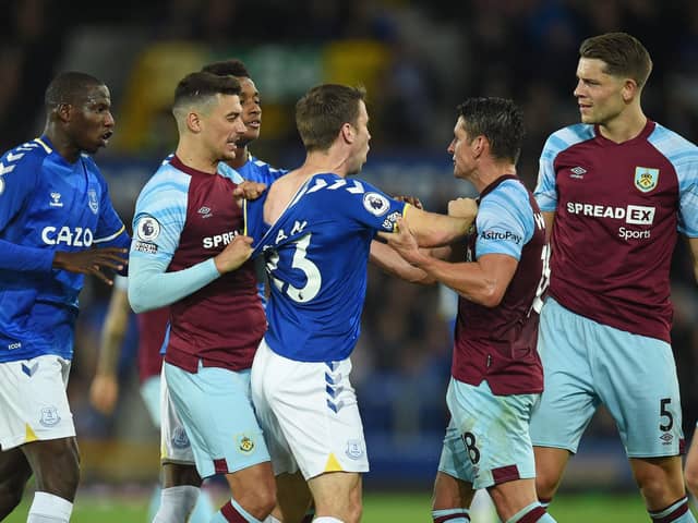 Everton's Abdoulaye Doucoure, Demarai Gray and Seamus Coleman clash with Burnley's Matthew Lowton, Ashley Westwood and James Tarkowski at Goodison Park in Liverpool, north west England on September 13, 2021.