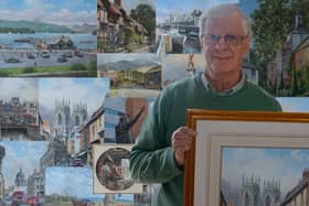 Artist John Chapman with his stunning collection of paintings
