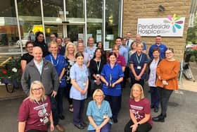 Staff at Pendleside Hospice celebrate winning the prestigious BIBA Community Business of the Year award