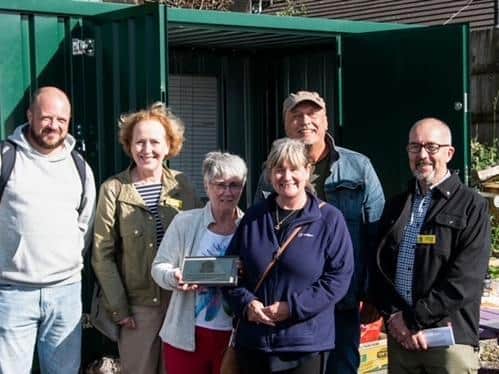The community gardens plaque, from the National Garden Society, was presented to the Colne Open Gate project.