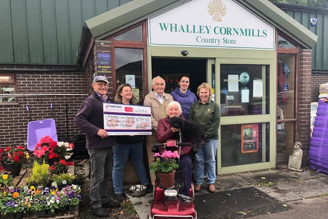 A gift in store for Rosemere Cancer Foundation from (left to right)
Whalley Corn Mills managing director Jonathan Townson, manager Pam
Floyd, John Townson, Dorothy Townson with Luna the dog, Sarah Hampson
and Kath Ormiston