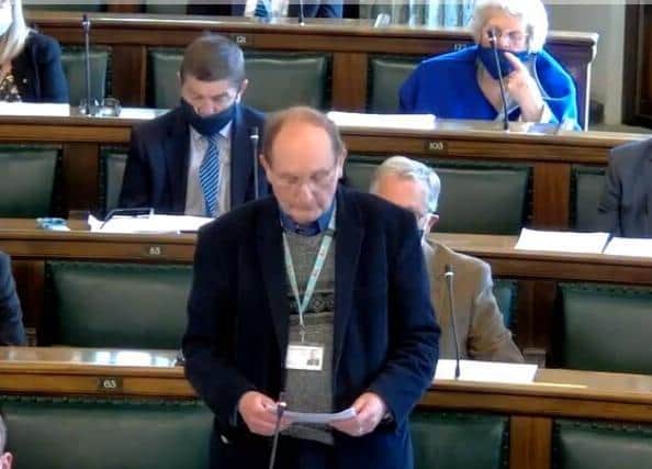 Lancashire county councillors were required to be socially-distanced and masked when not speaking in the chamber at the authority's full council meeting in May - before the full lifting of lockdown (image via Lancashire County Council webcast)